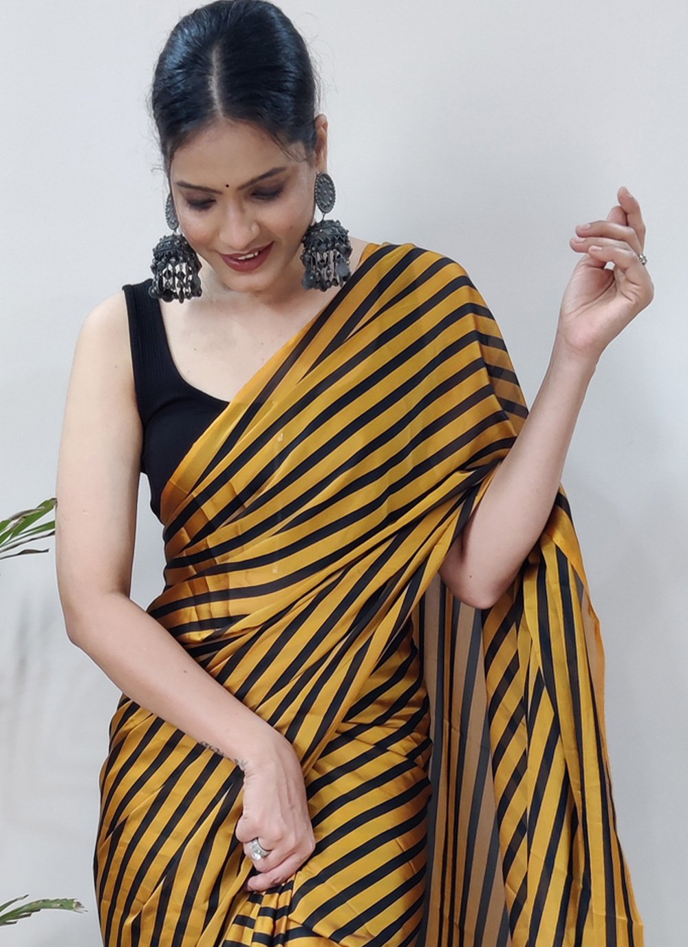 Trendy Saree Rangoli Silk Black Gold Strips Print Saree