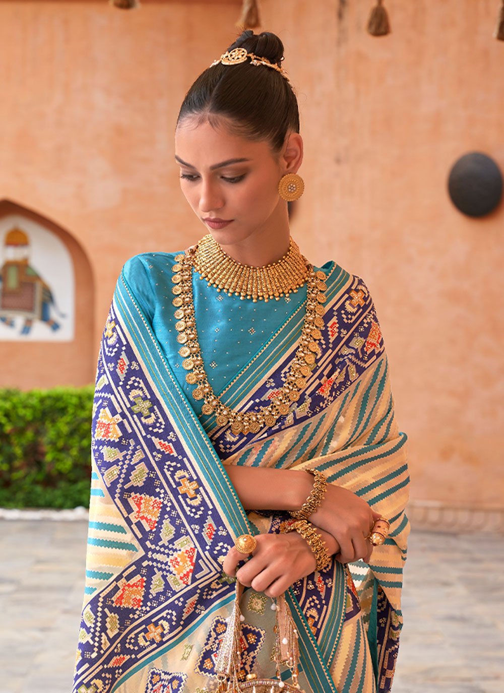 Contemporary Brasso Aqua Blue Cream Fancy Work Saree