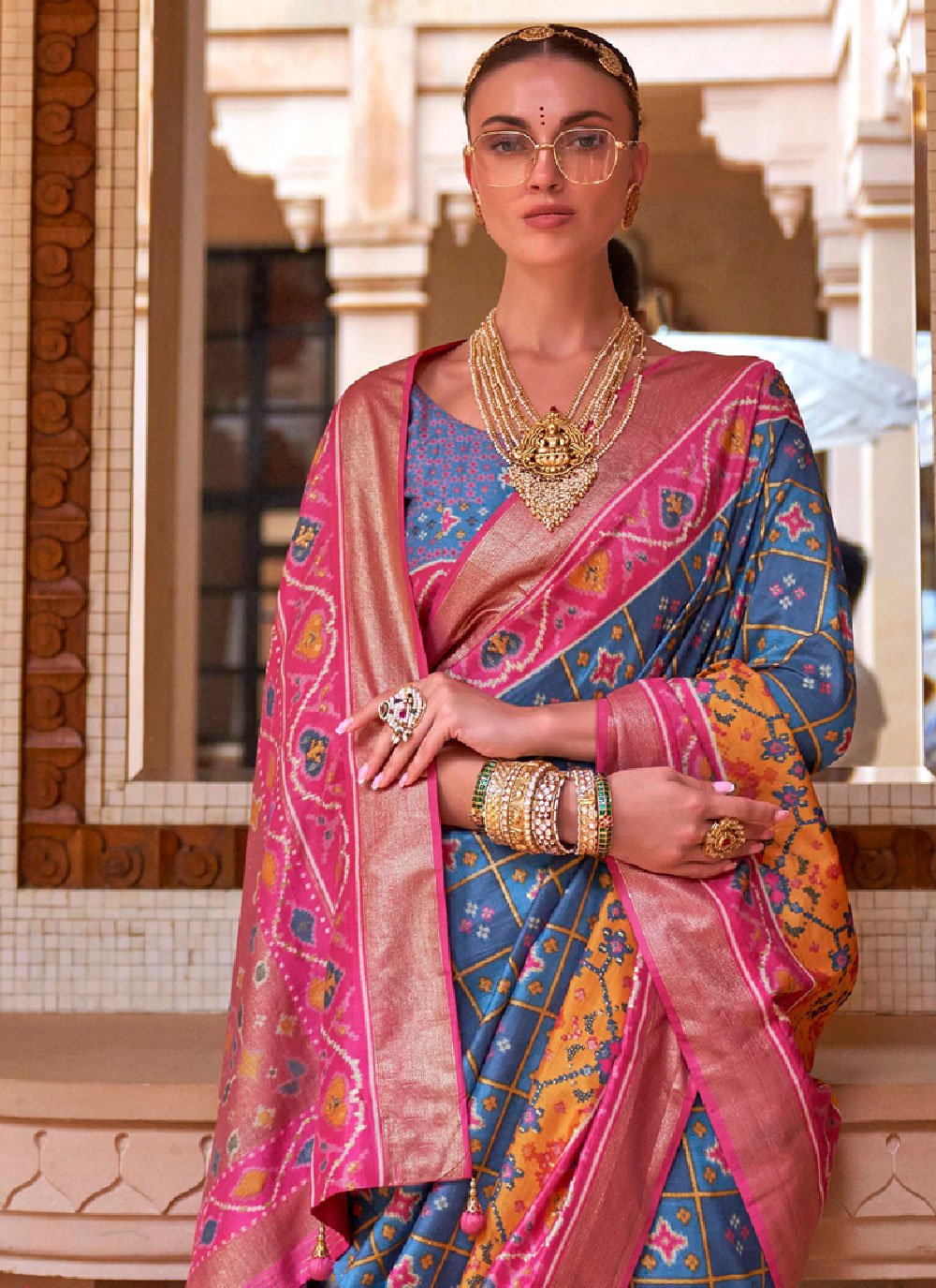 Contemporary Patola Silk Blue Pink Patch Border Saree