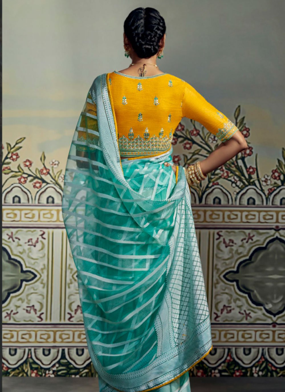 Contemporary Brasso Turquoise Fancy Work Saree