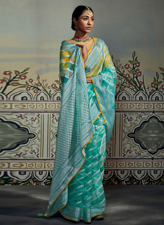 Contemporary Brasso Turquoise Fancy Work Saree