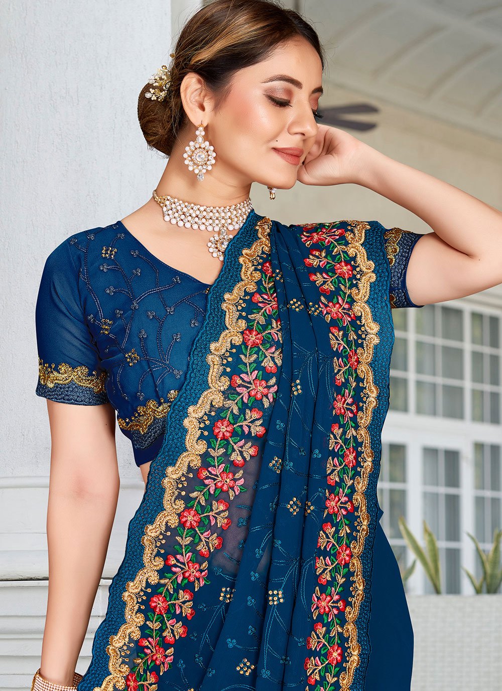 Contemporary Georgette Teal Embroidered Saree