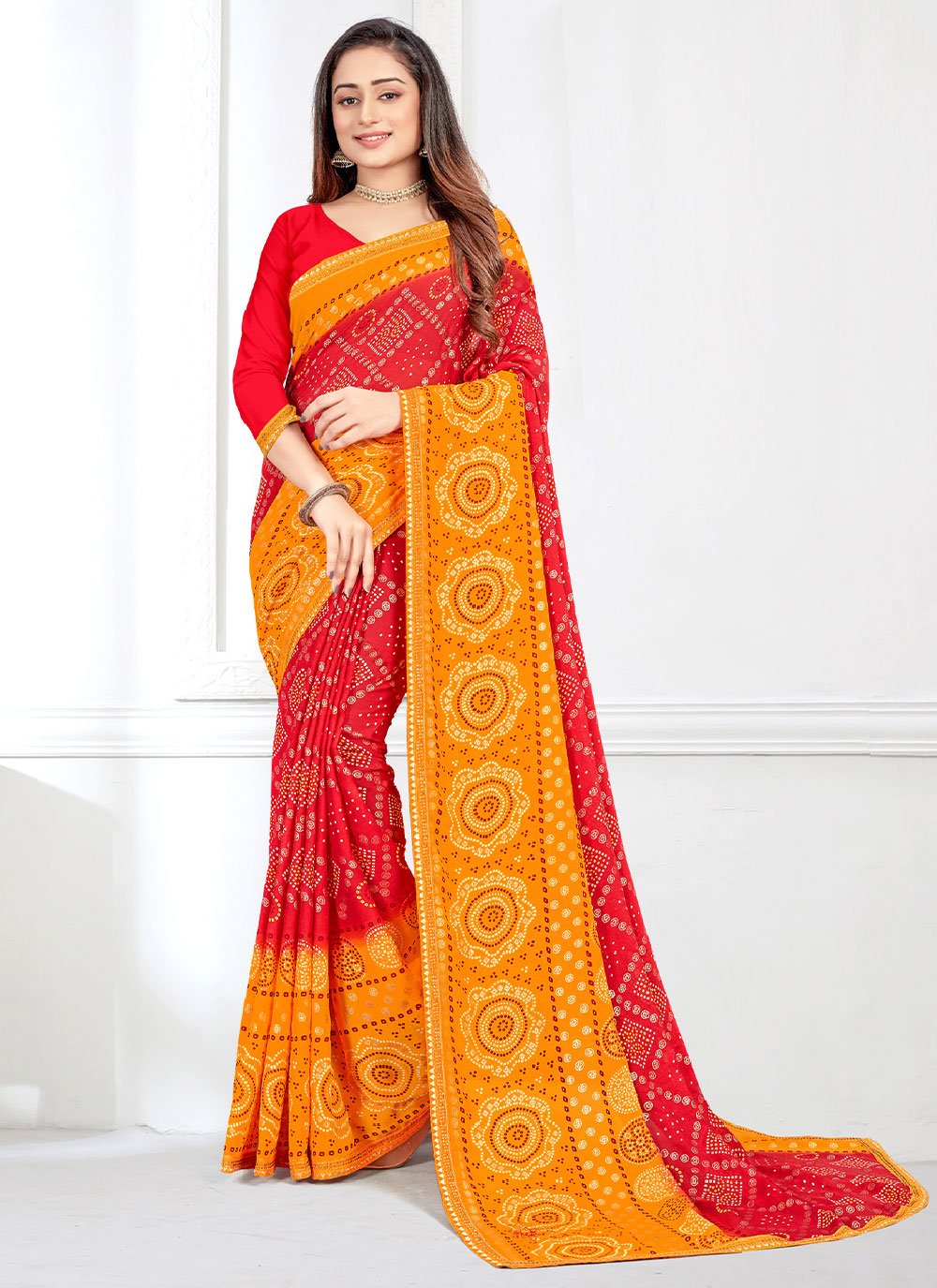 Contemporary Faux Crepe Orange Red Bandhej Saree