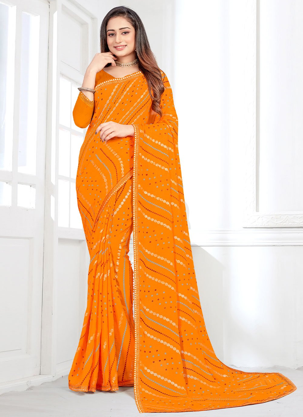 Contemporary Faux Crepe Orange Bandhej Saree