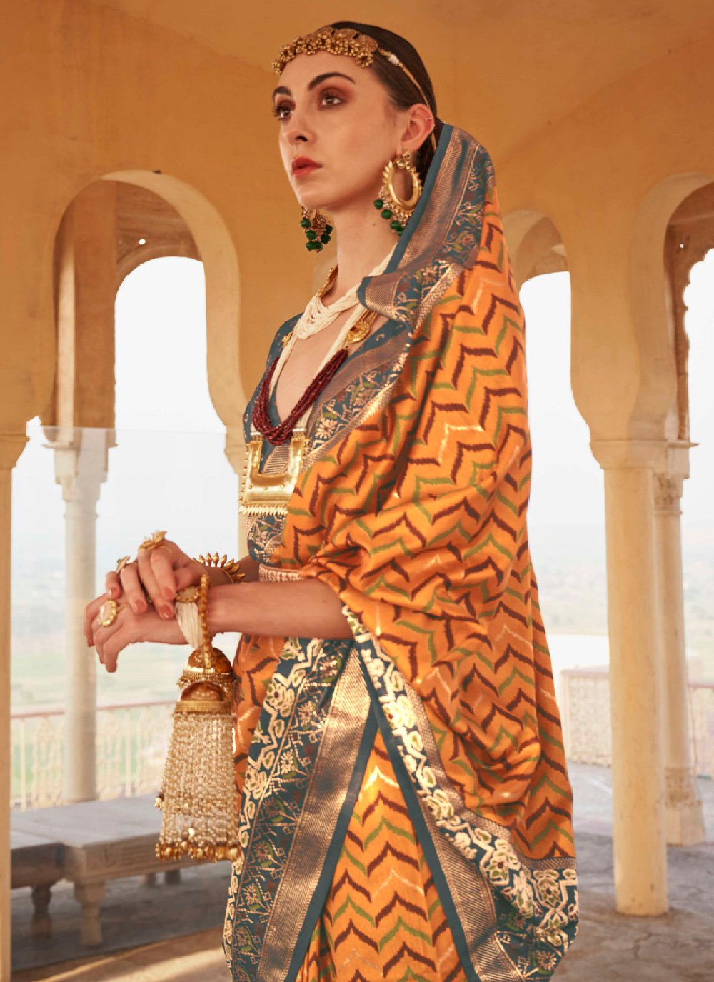 Classic Silk Grey Orange Patola Print Saree