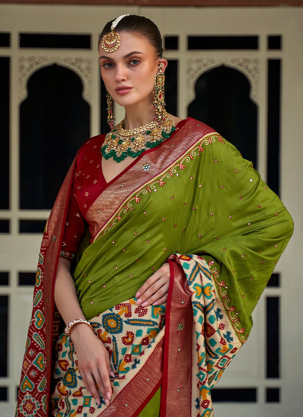 Contemporary Patola Silk Green Aari Work Saree