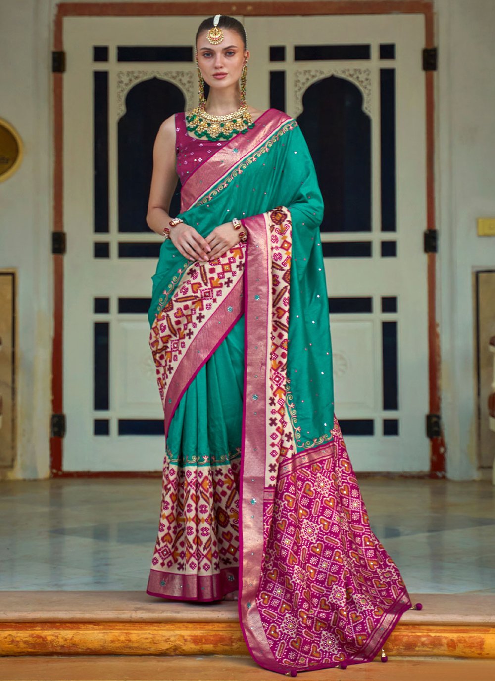 Contemporary Patola Silk Sea Green Aari Work Saree