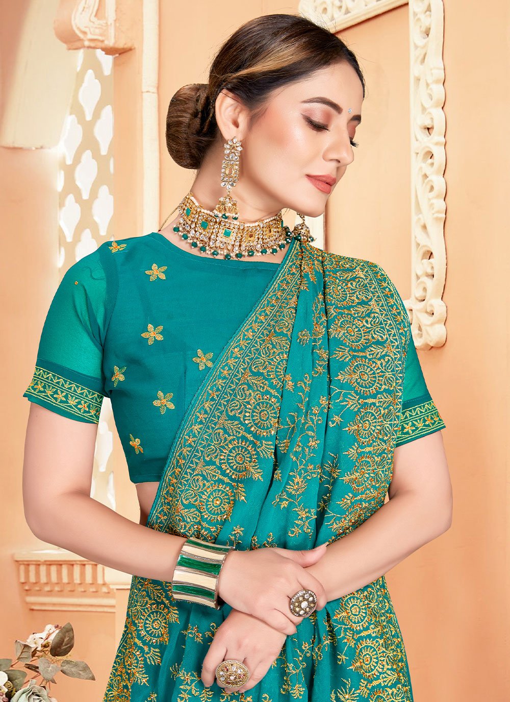 Classic Georgette Turquoise Embroidered Saree