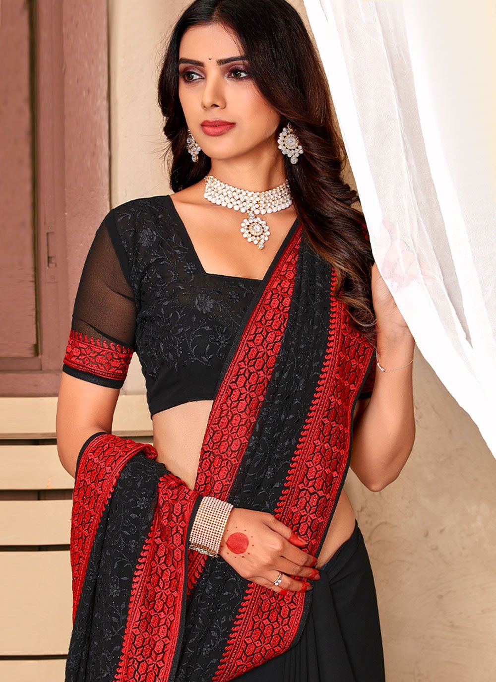 Classic Georgette Black Embroidered Saree